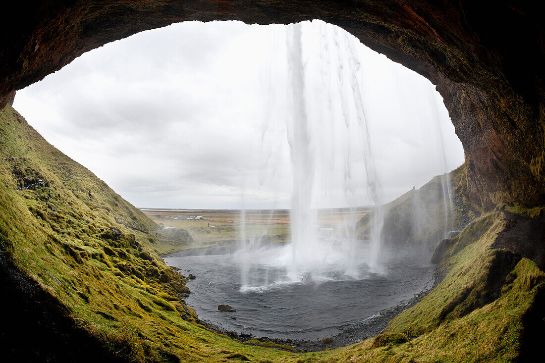 'Seljalandsfoss waterfall, photographed from behind the water; Iceland'