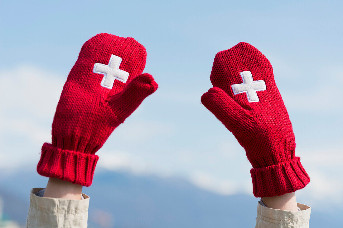 'Mittens with the Swiss flag symbol; Ascona, Ticino, Switzerland'