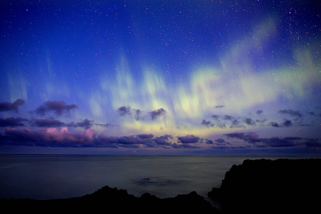 'Dramatic scene of the northern lights showing the Atlantic Ocean off the coast of Iceland; Iceland'