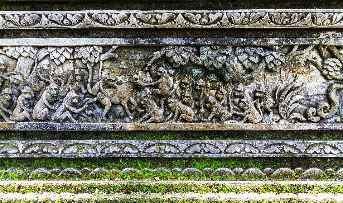 Bas-relief featuring monkeys on Pura Dalem Agung Padangtegal, or Padangtegal Great Temple of Death in the Sacred Monkey Forest of Padangtegal, Ubud, Bali, Indonesia