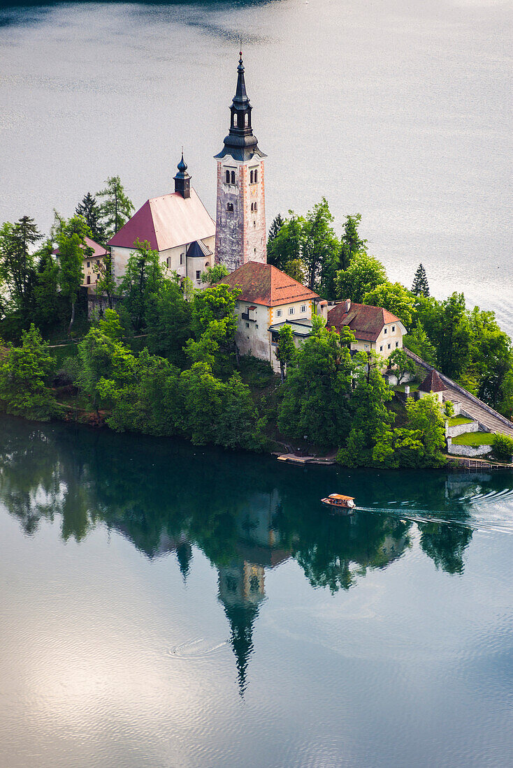 Lake Bled boat (Pletna) at Lake Bled Island at sunrise, Gorenjska, Slovenia, Europe