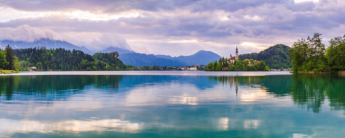 Lake Bled at sunrise with the Church on Lake Bled Island and Bled Castle, Gorenjska Region, Slovenia, Europe