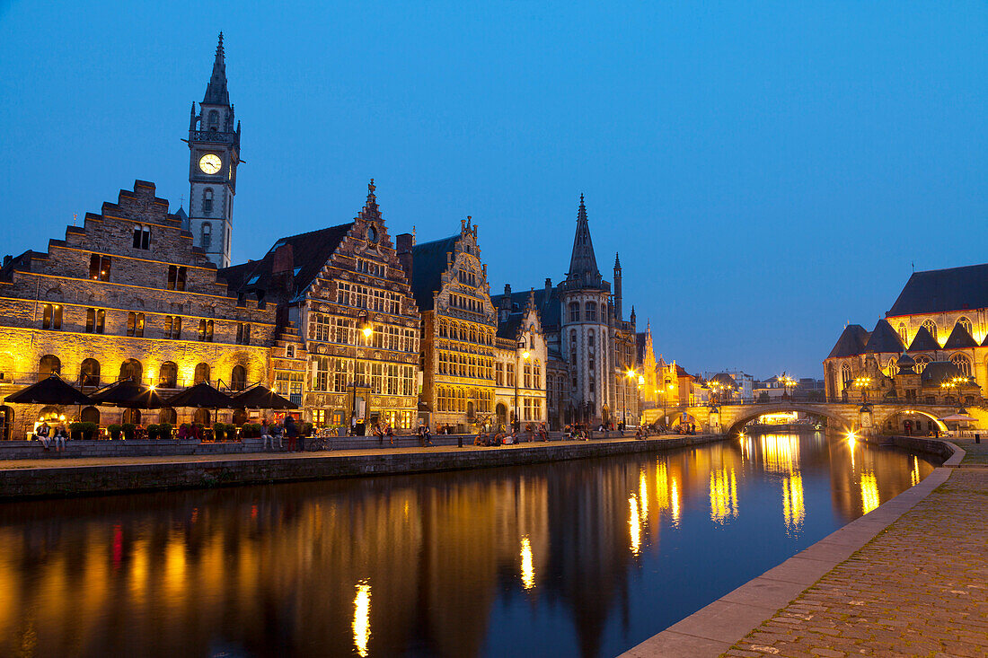 Buildings lit up at night along the Graslei, a Medieval Port in the Historic Center of Ghent, Belgium, Europe