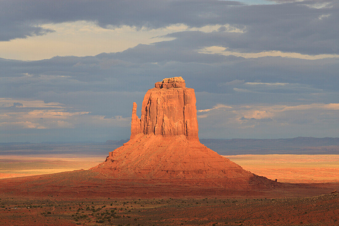 Mitten at dusk lit by late evening sun, Monument Valley Navajo Tribal Park, Utah Arizona border, United States of America, North America