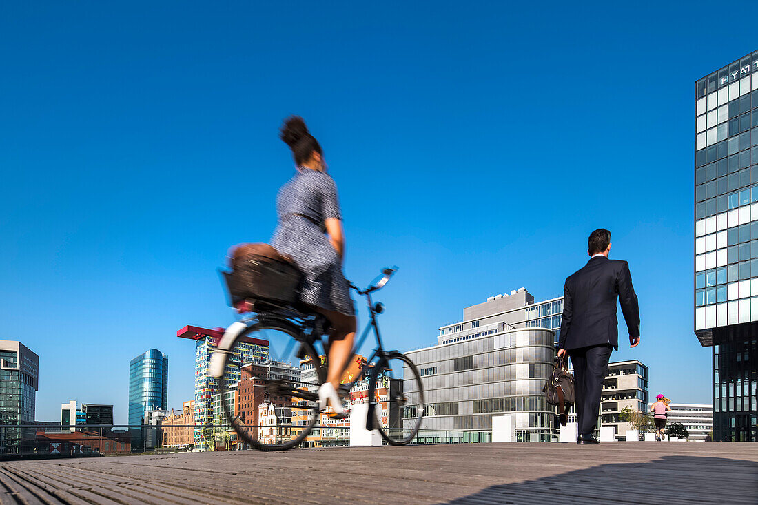 Cyclist, Media harbour, Duesseldorf, North Rhine Westphalia, Germany