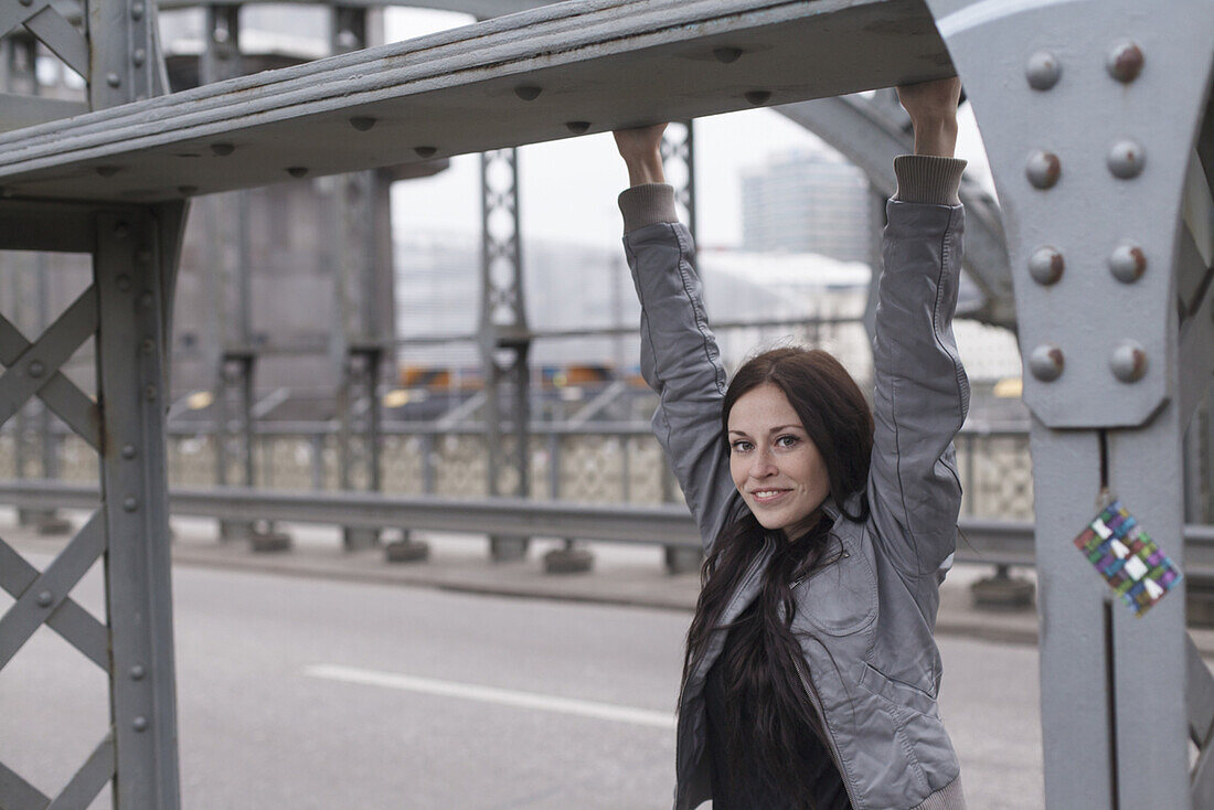 Young woman on Hacker Bridge, Munich, Bavaria, Germany