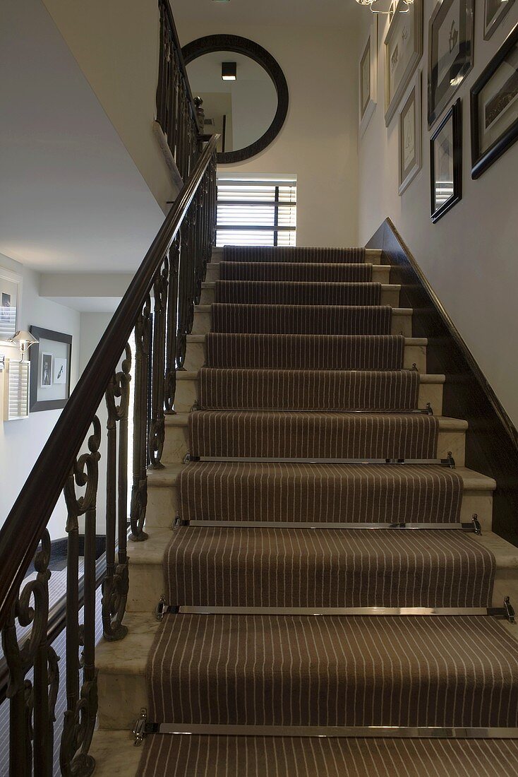 Stairway with a striped stair runner