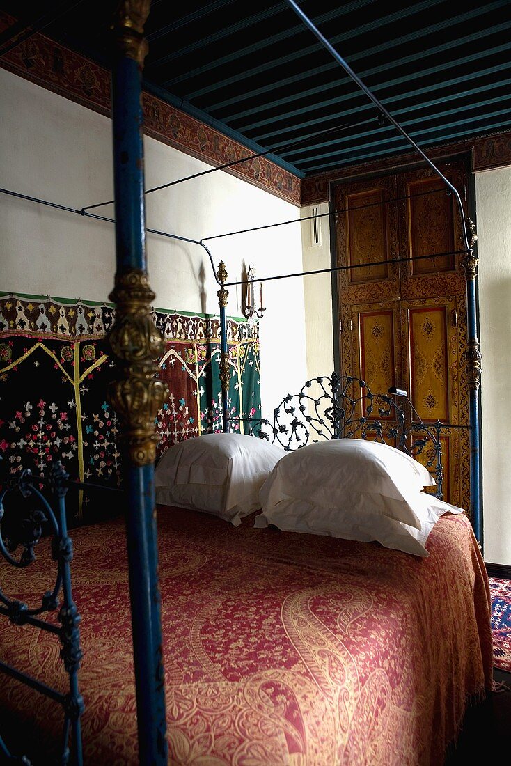 Oriental bedroom with a canopy bed