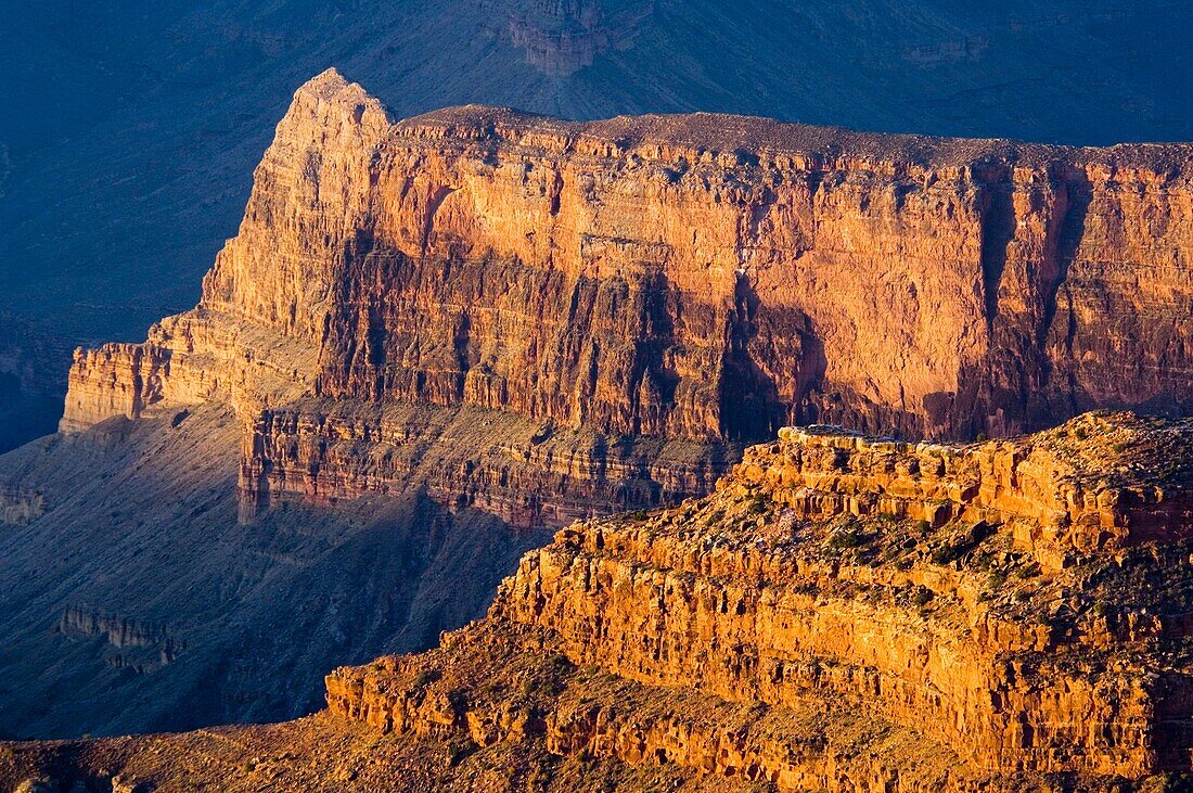 Sunrise light on red rock cliff formations below the North Rim at Point Sublime, Grand Canyon National Park, Arizona