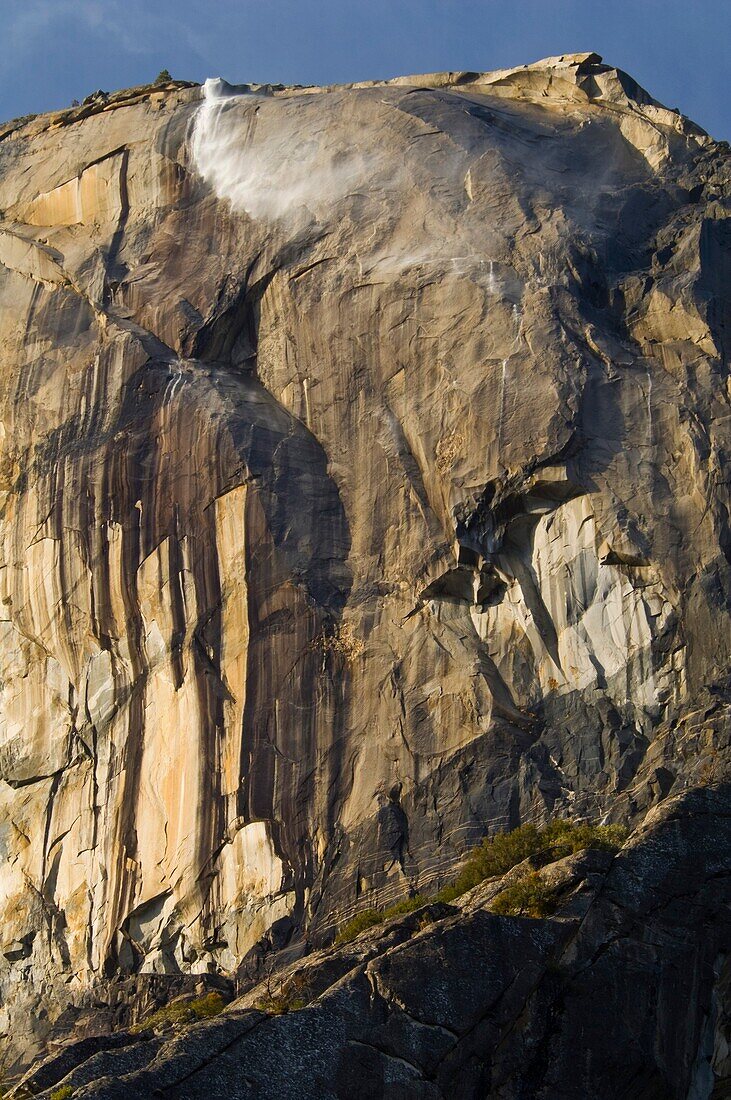 Wind blown Horsetail Falls water streaming off El Capitan, above Yosemite Valley, Yosemite National Park, California