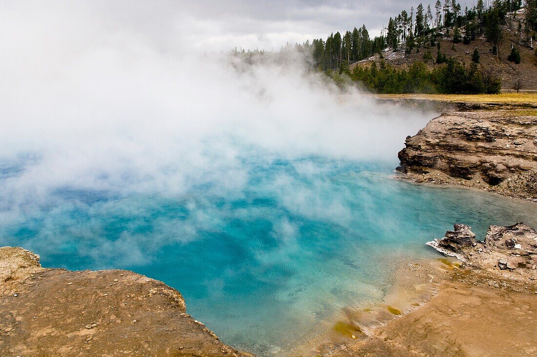 Geothermal steam rising out of Excelsior Geyser Crater, Midway Geyser Basin, Yellowstone National Park, Wyoming