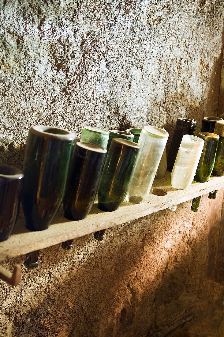 A bottle rack with empty bottles