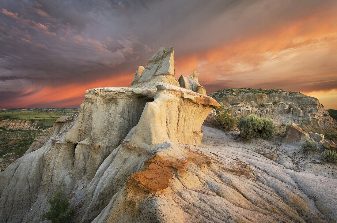 Clearing storm at sunrise over badlands sandstone formations, Theodore Rossevelt National Park, North Dakota.