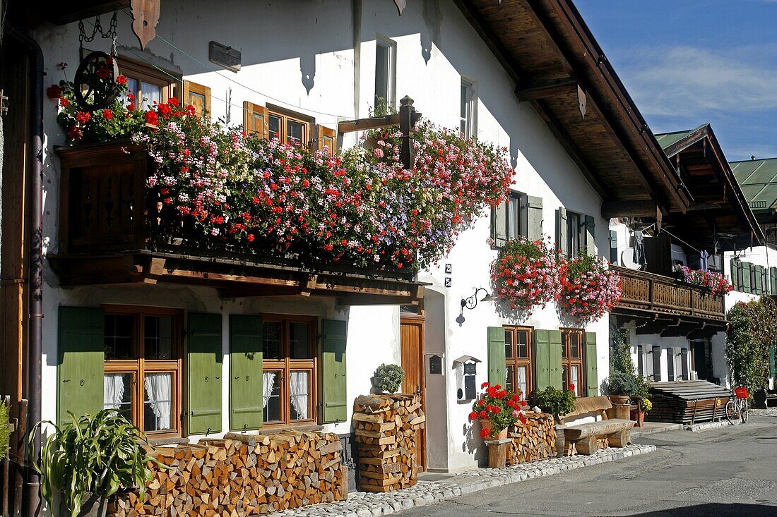 Germany Bavaria Garmisch-Partenkirchen Fruhling Strasse decorated bavarian buildings with balconies and flowers architecture