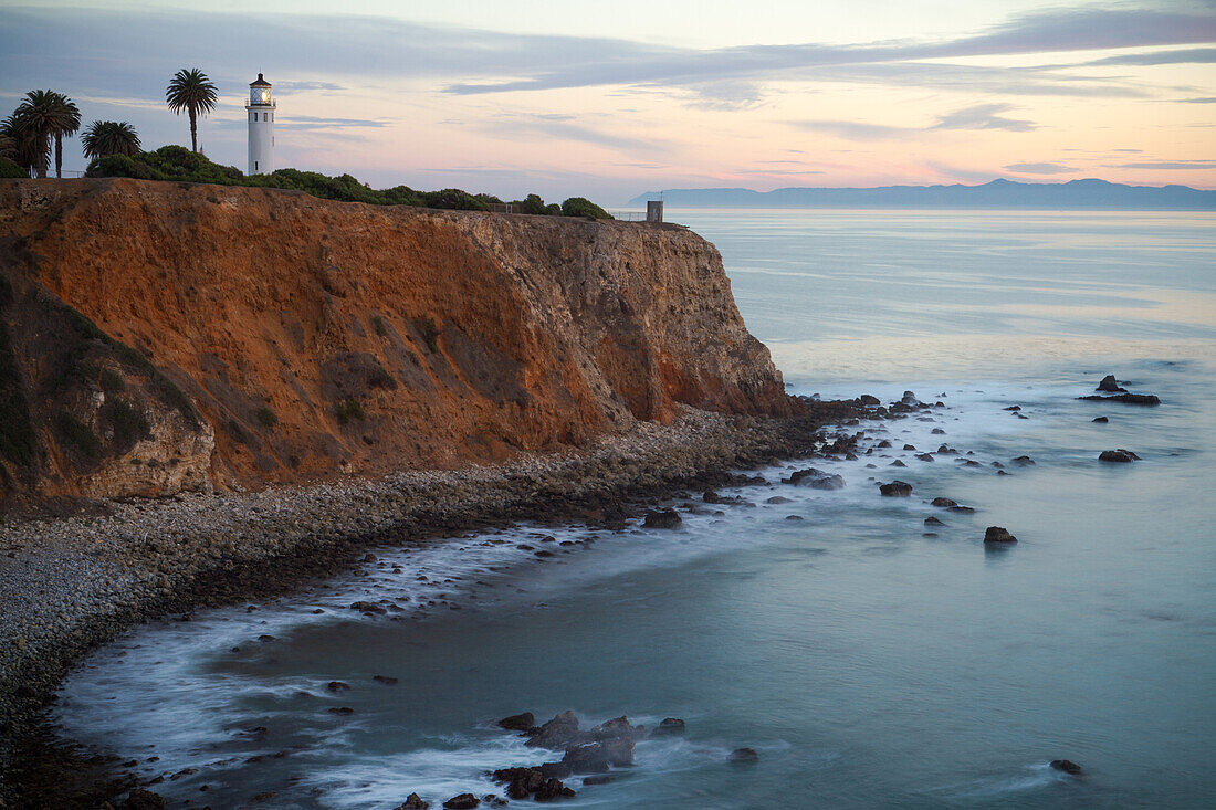Point Vincente Lighthouse at sunset along the southern California coastline.