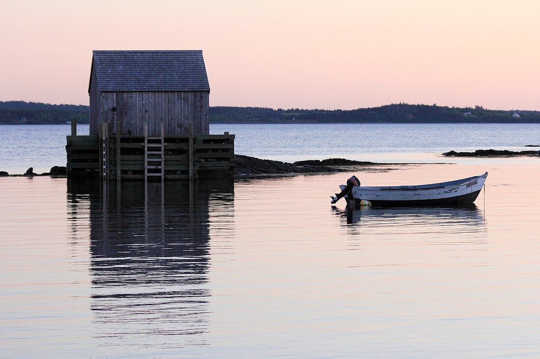 a wharf fish shack and boat in a fishing village near Lunenburg Nova Scotia