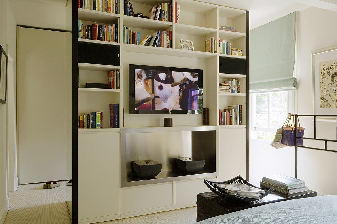 A floor-to-ceiling shelf-cupboard as a … – License image – 706546 Image ...