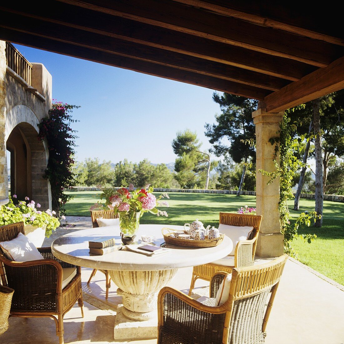 A coffee break on a terrace of a finca with a beautiful view of the garden