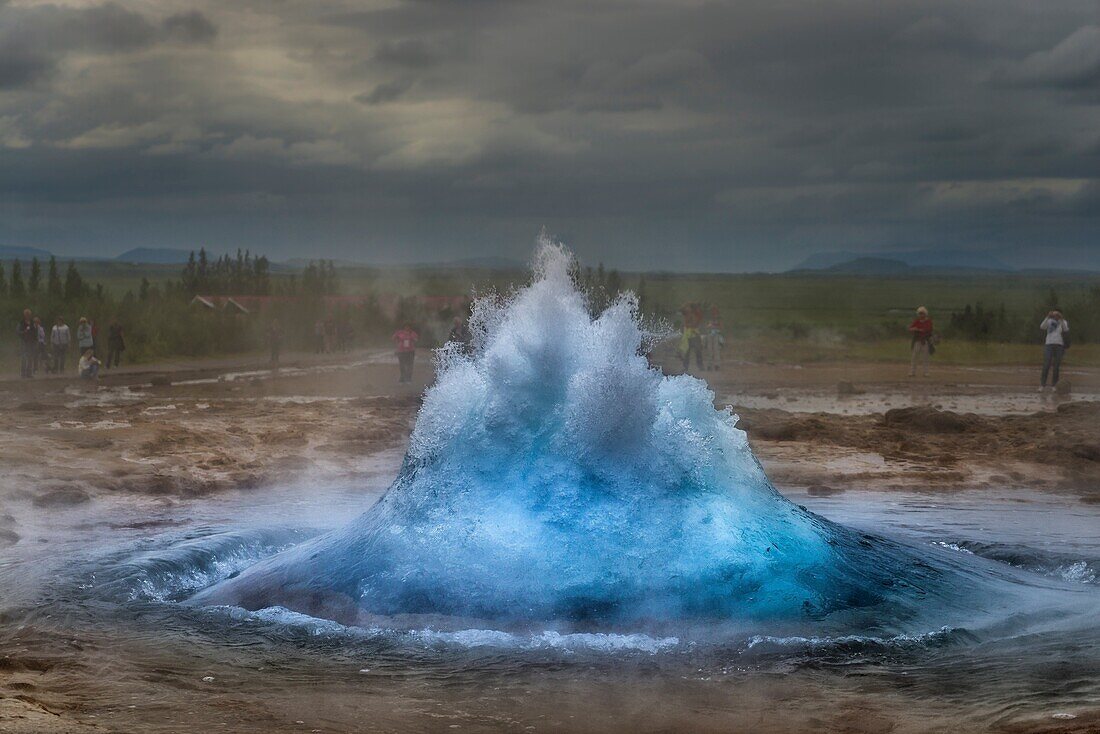 Strokkur Geyser just before it erupts, Iceland. Strokkur is a fountain geyser in the geothermal area beside the Hvita River in the Haukadalur valley, erupting about every 10 minutes or so. The white column of boiling water can reach as high as 20-30 meter