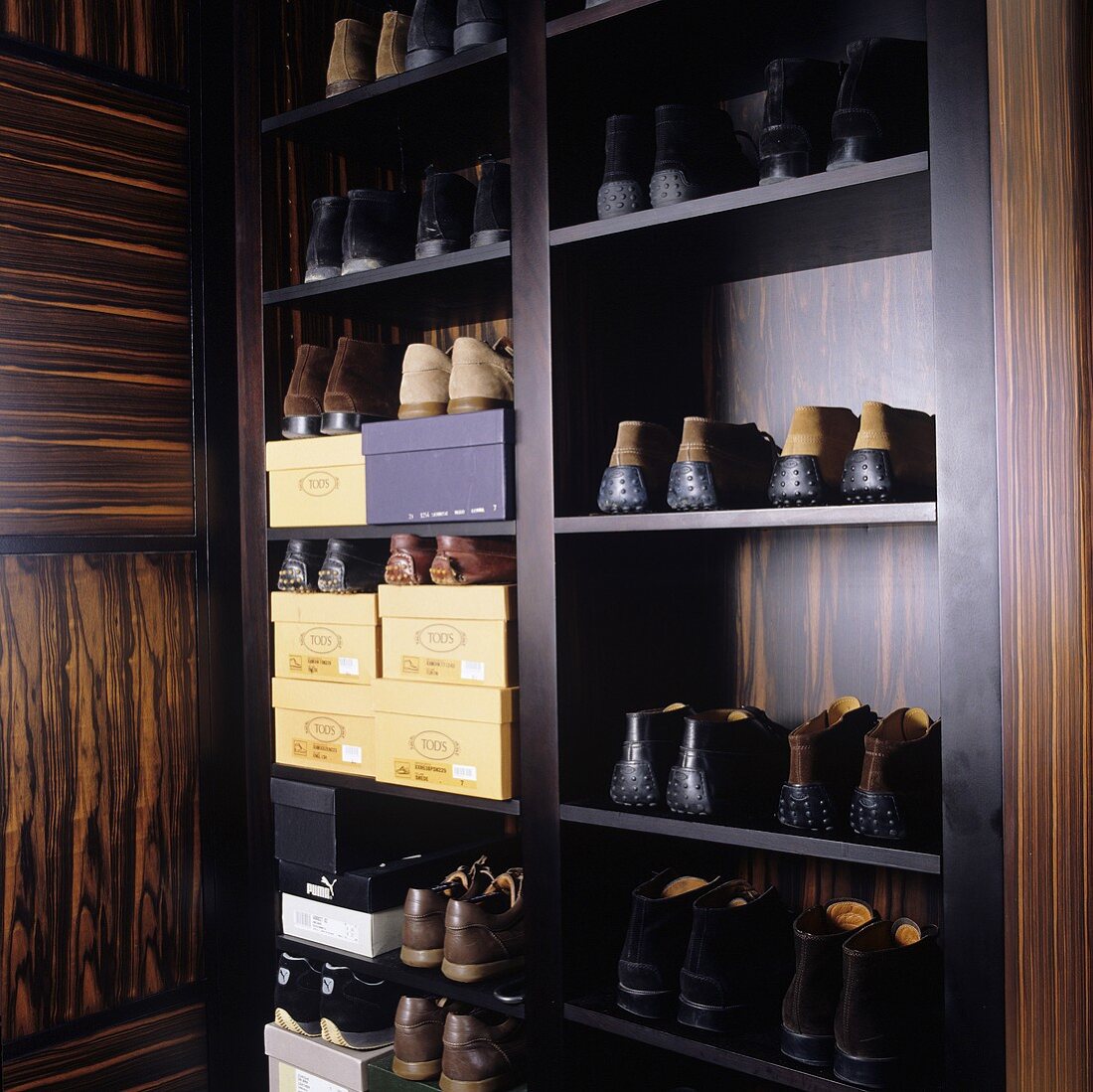 Shoes in a wardrobe made of tropical wood