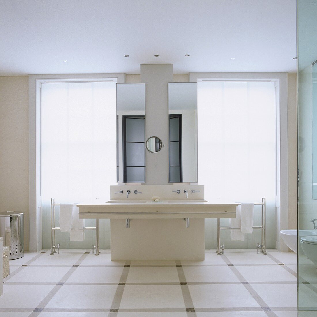 A white wall table with a designer mirrored cabinet