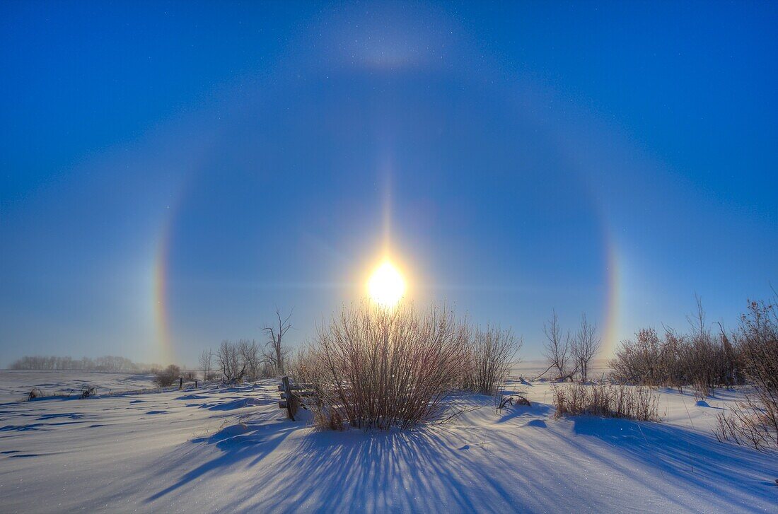 Sundogs and a solar halo around the Sun, December 19, 2013, shot from home with the Canon 60Da and 10-22mm lens. The halo is caused by ice crystals in the air, in this case very nearby as they can be seen as stars sparkling in the sunlight in the sky and 