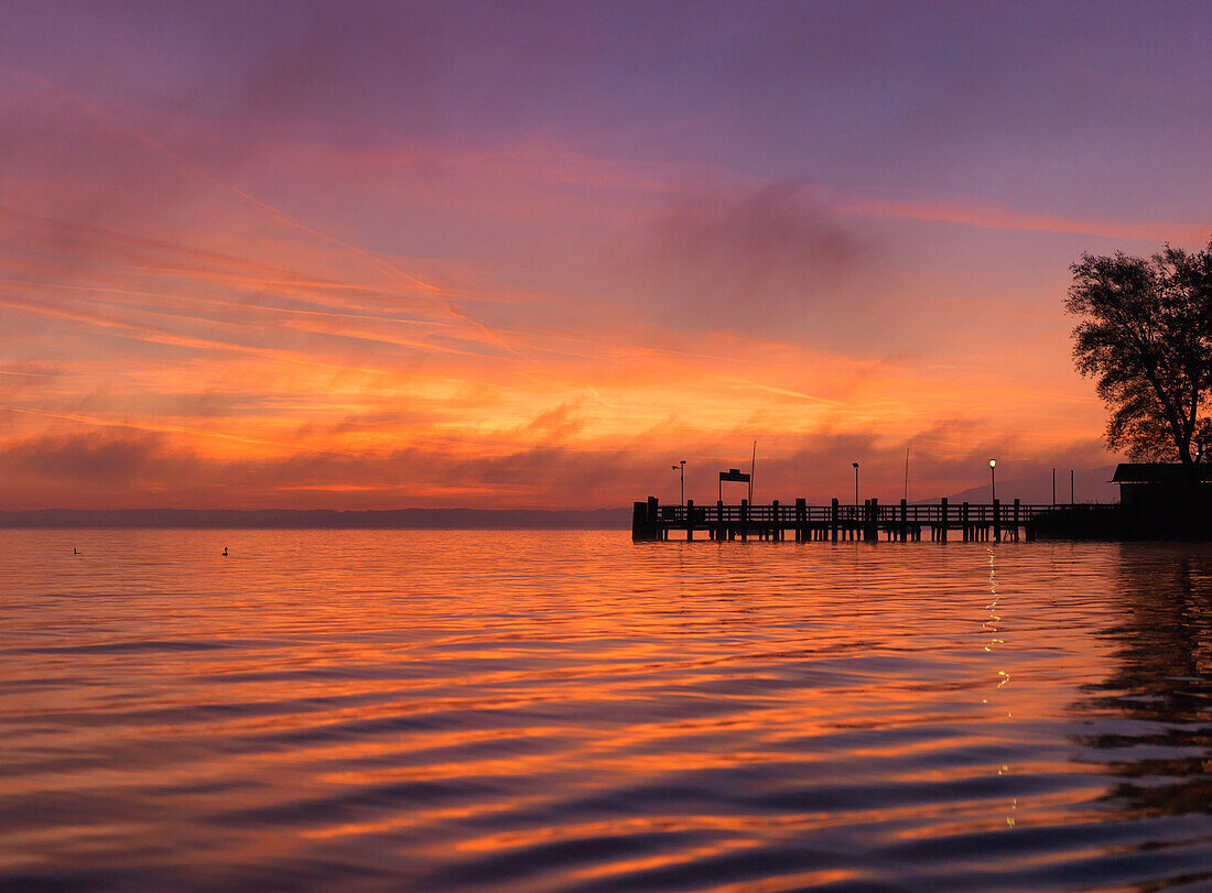 North pier at sunrise, Fraueninsel, lake Chiemsee, Bavaria, Germany