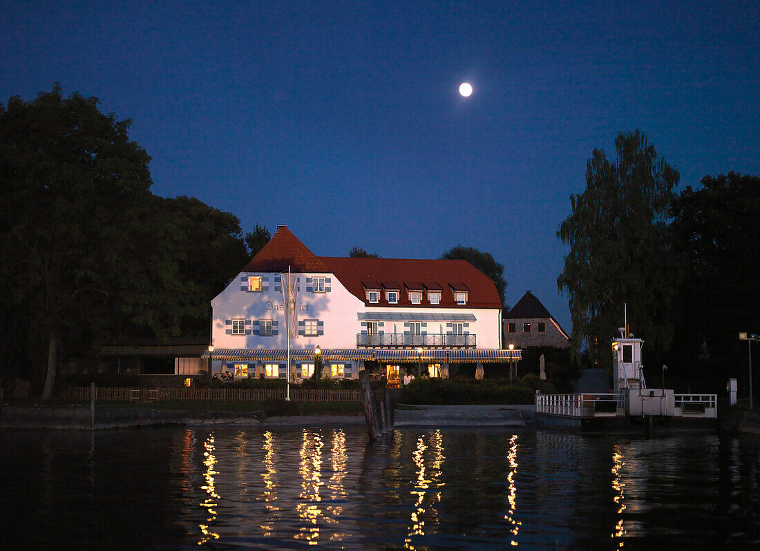 Hotel Restaurant Inselwirt at full moon, Fraueninsel, lake Chiemsee, Bavaria, Germany