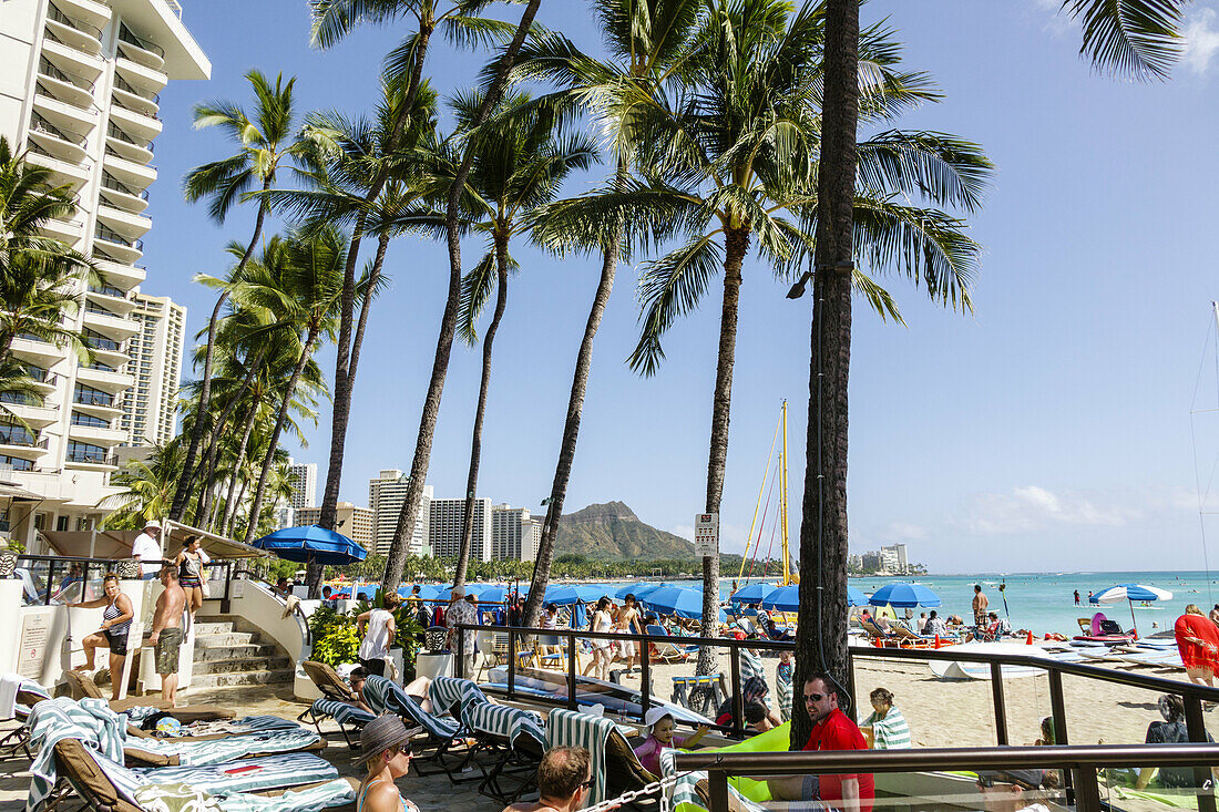 Hawaii, Hawaiian, Oahu, Honolulu, Waikiki Beach, Pacific Ocean, Outrigger Waikiki on the Beach, hotel, waterfront, sunbathers, guests, palm trees.