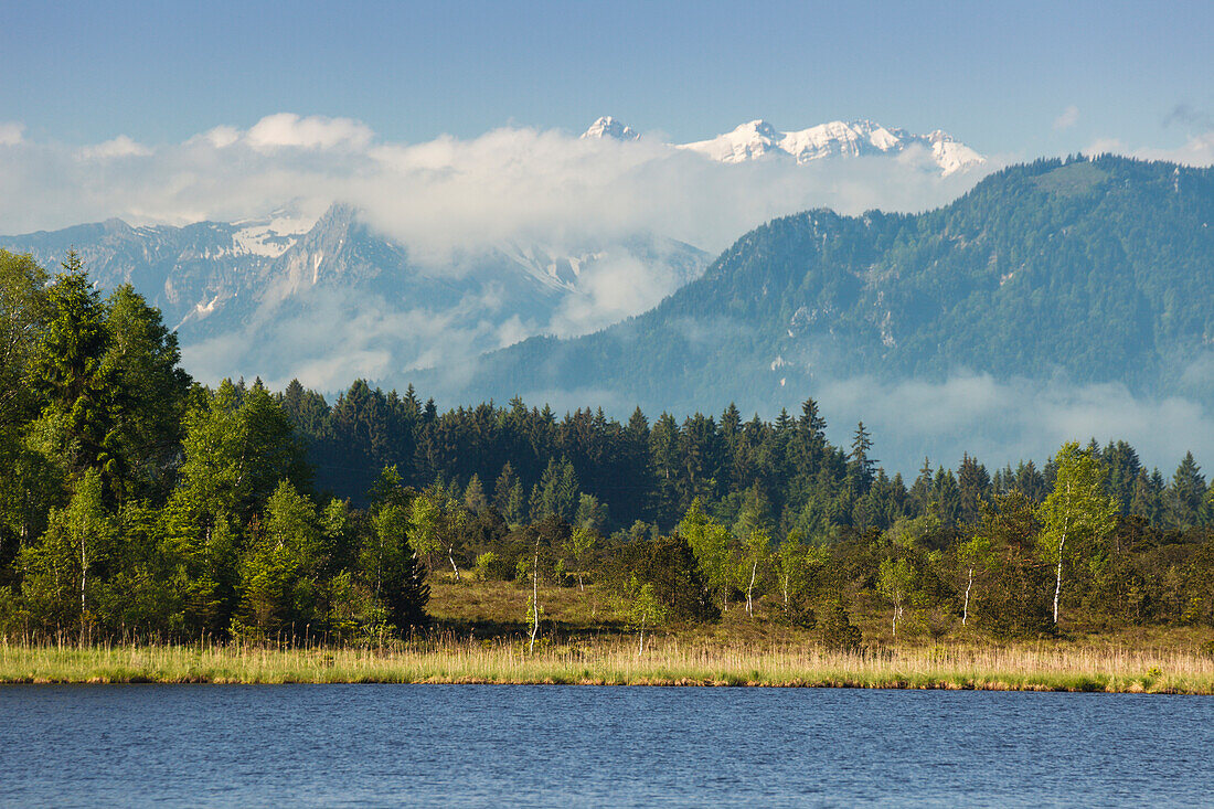 Kirchsee, lake near Sachsenkamm in Spring, Bavarian alps with snow, moorland lake, Ellbach and Kirchseemoor, nature reserve, Landkreis Bad Toelz- Wolfratshausen, Upper Bavaria, Bavaria, Germany, Europe