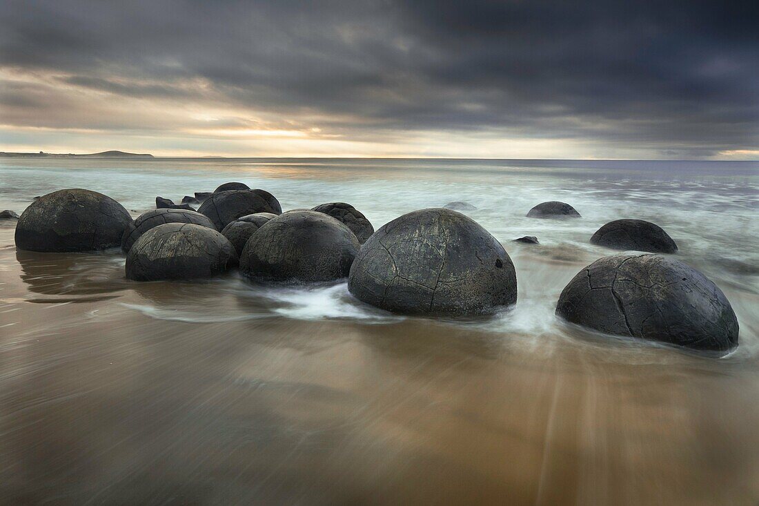 Moeraki boulders, sombre winter dawn, near Oamaru, Otago, South Island, New Zealand