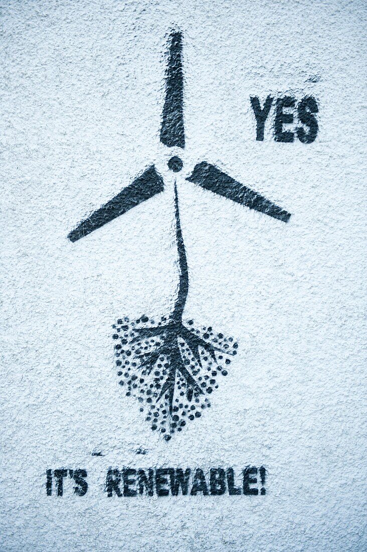 Pro wind farm graffiti stencilled on a wall of a house in the village of New Radnor, Powys, Mid Wales UK