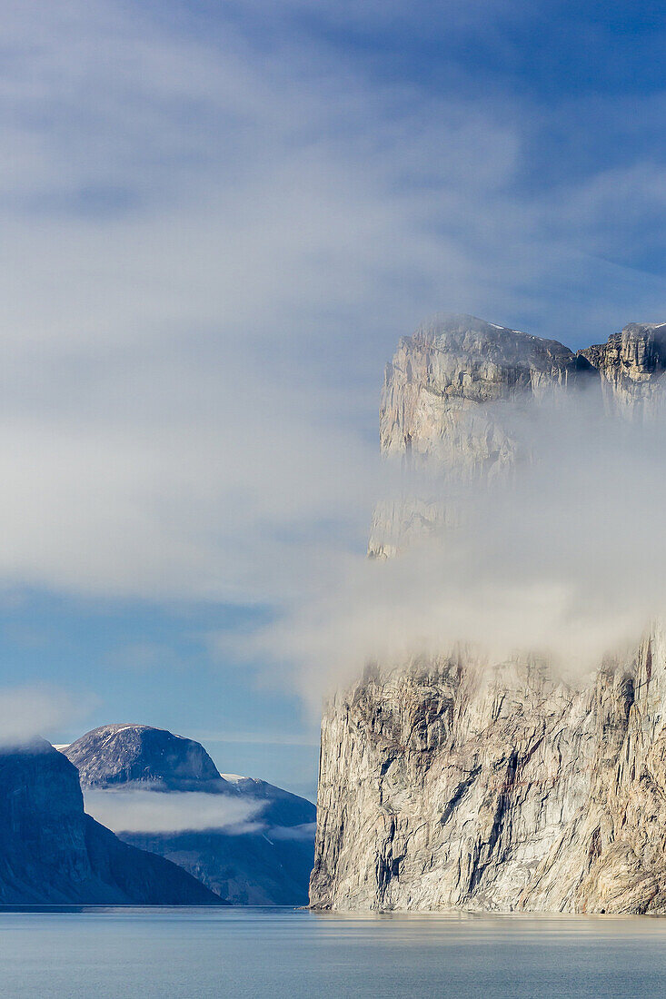 Fog lifting on the steep cliffs of Icy Arm, Baffin Island, Nunavut, Canada.