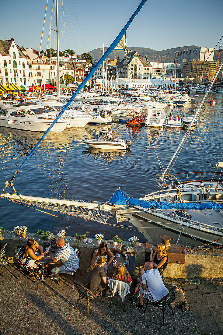 Outdoor terrace of XL Diner restaurant, and View of Harbour,Brosundet,Alesund, More og Romsdal, Norway.