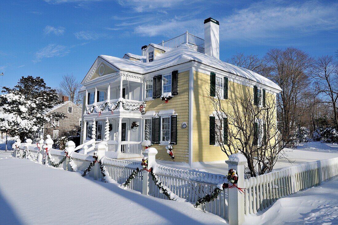 Historic house in Falmouth, Cape Cod, decorated for Christmas with fresh heavy snowfall