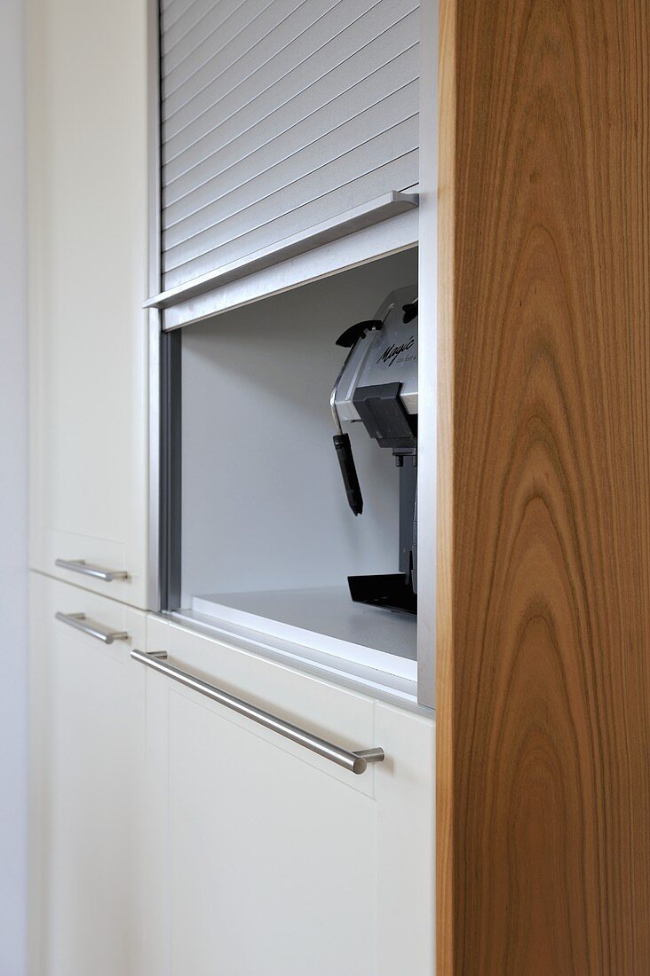 Storage with shutter in fitted kitchen unit