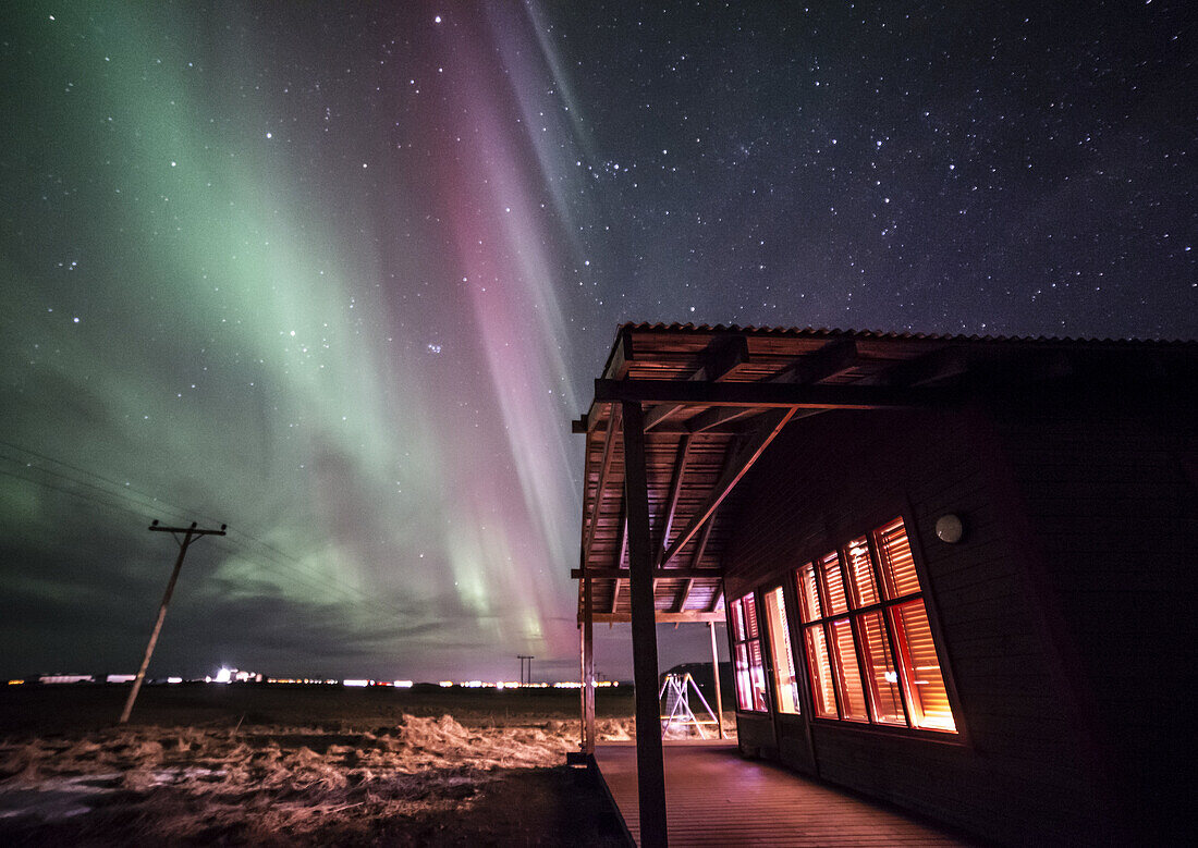 Winter Icelandic landscape with Northern lights background. Iceland.
