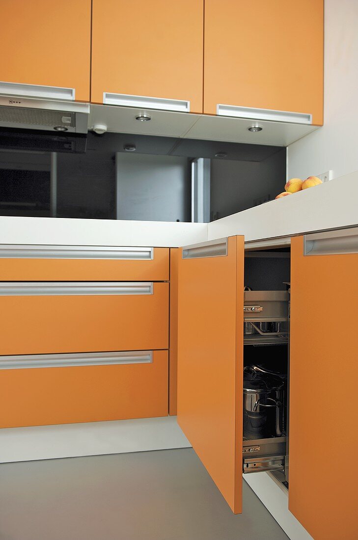 Modern kitchen with orange units