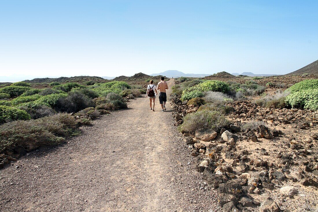 Walkers Small island of Lobos near Fuerteventura Canary islands Spain