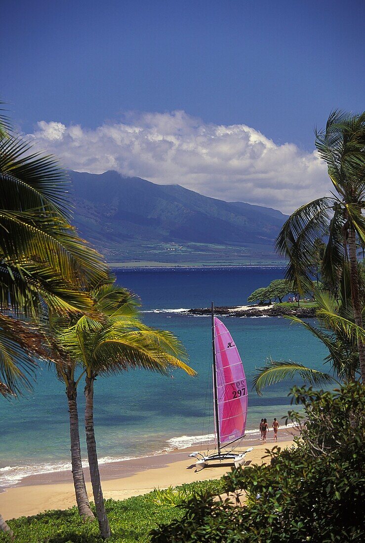 Sailboat on the beach with the West Maui Mountains behind at Wailea Beach, Maui, Hawaii