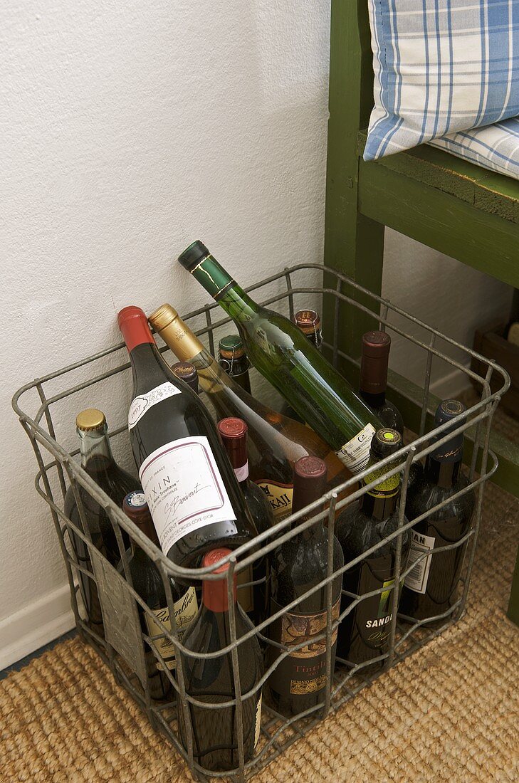 Bottles of wine in metal basket