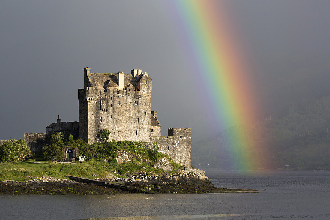 Eilean Donan Castle with rainbow, near Dornie, Scotland.