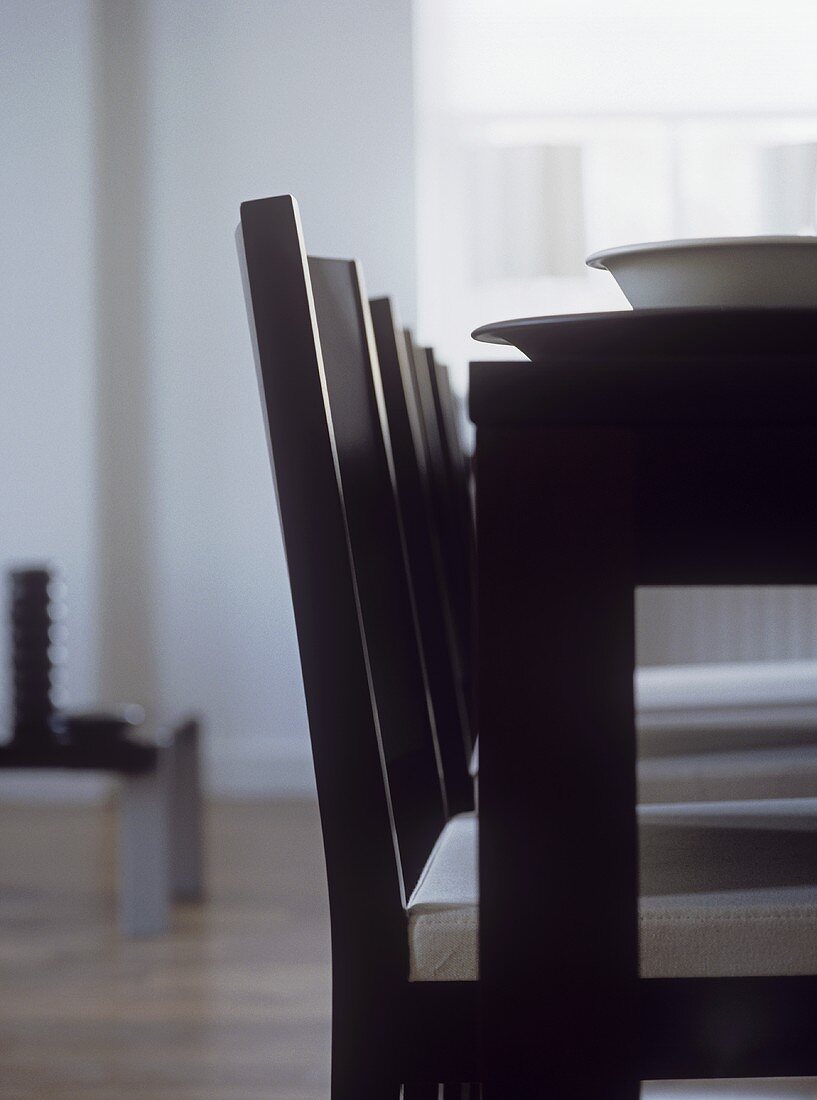Close up of black dining table and chairs