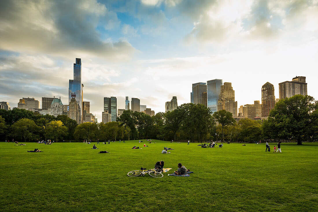 People relaxing on the Sheep Meadow, Central Park, Manhattan, New York, USA