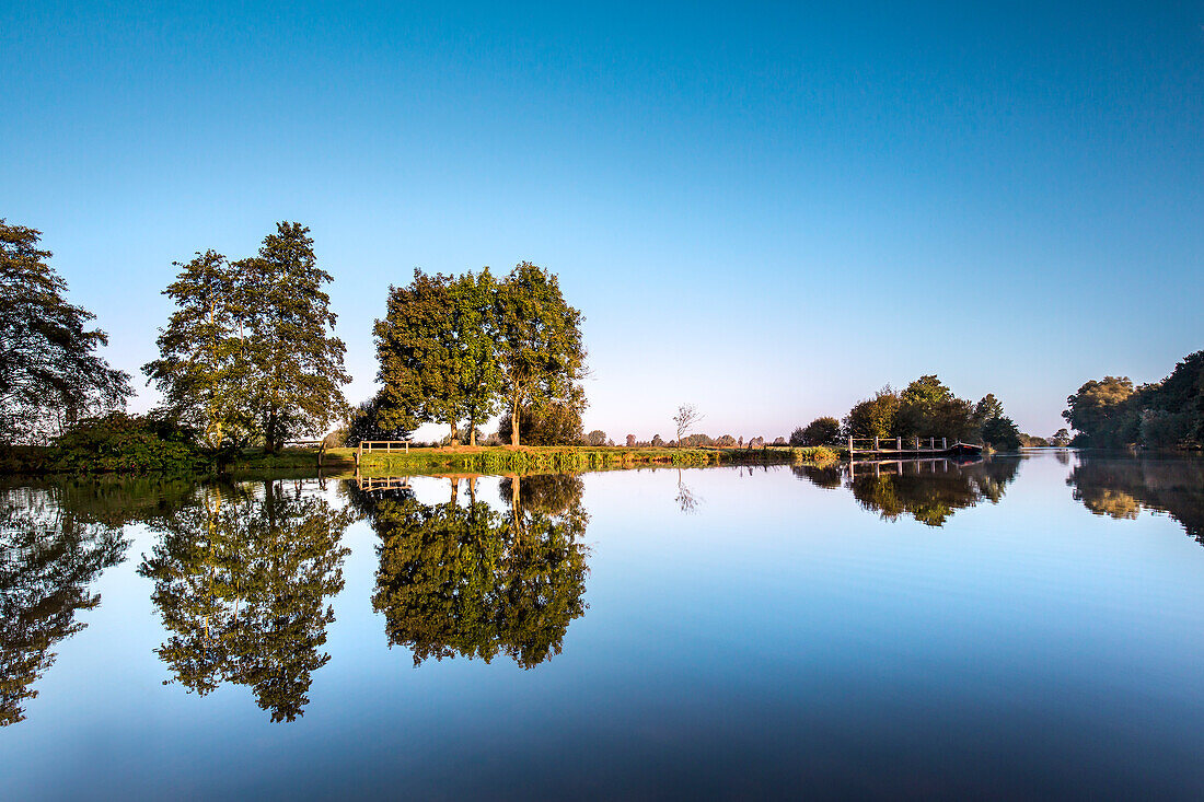 Water reflections at the river Hamme, Worpswede, Teufelsmoor, Lower Saxony, Germany