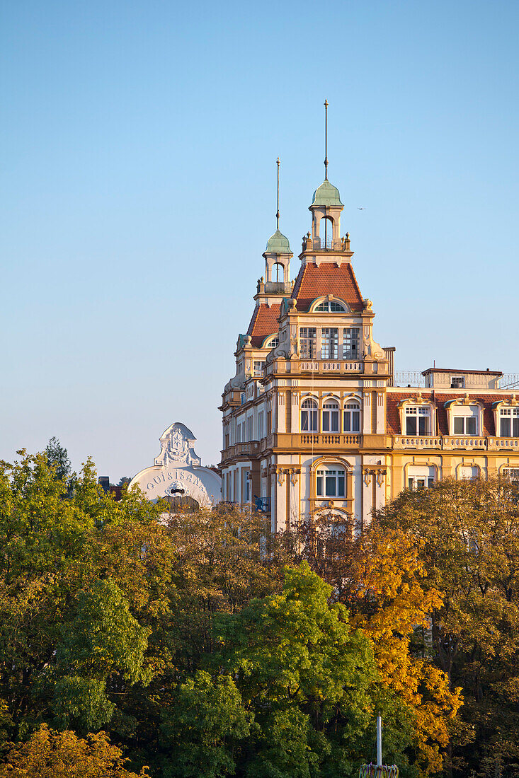 The towers of Fuerstenhof in Art Nouveau style with the gable of Villa Quisisana (now Hotel Quellenhof) behind it in autumn, Bad Wildungen, Hesse, Germany, Europe