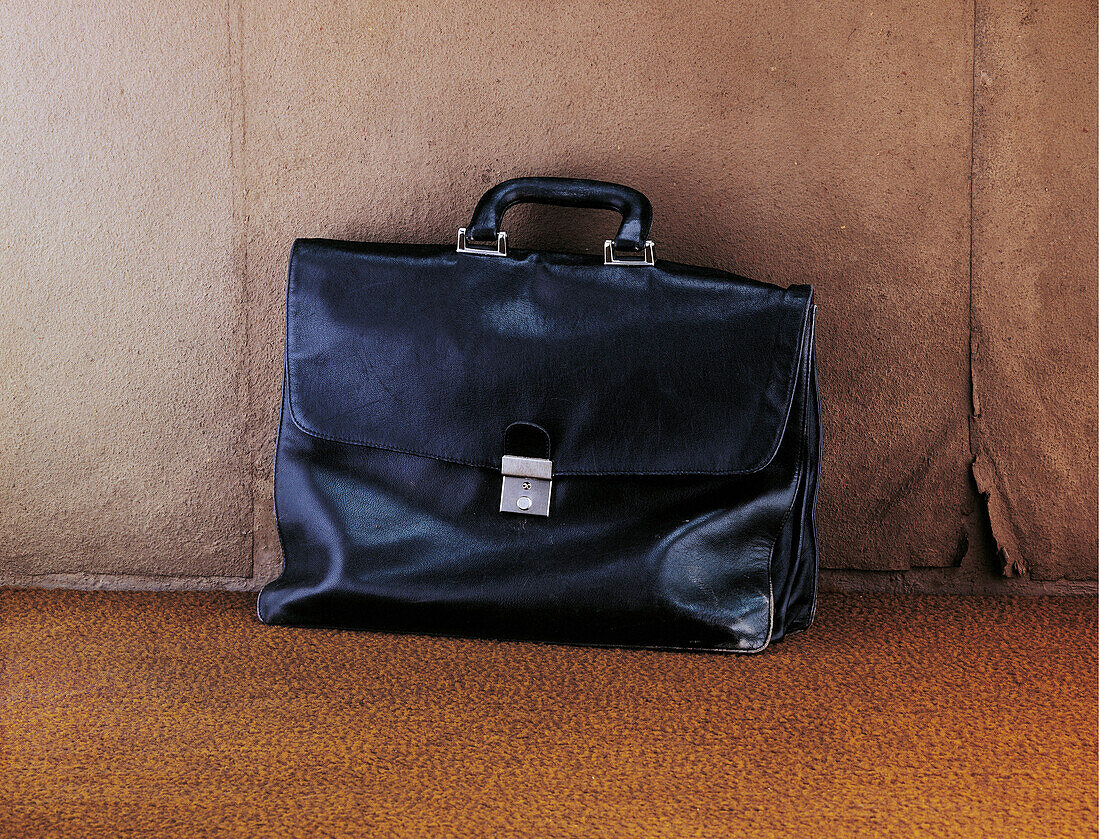 Briefcase against a wall, Business, Work