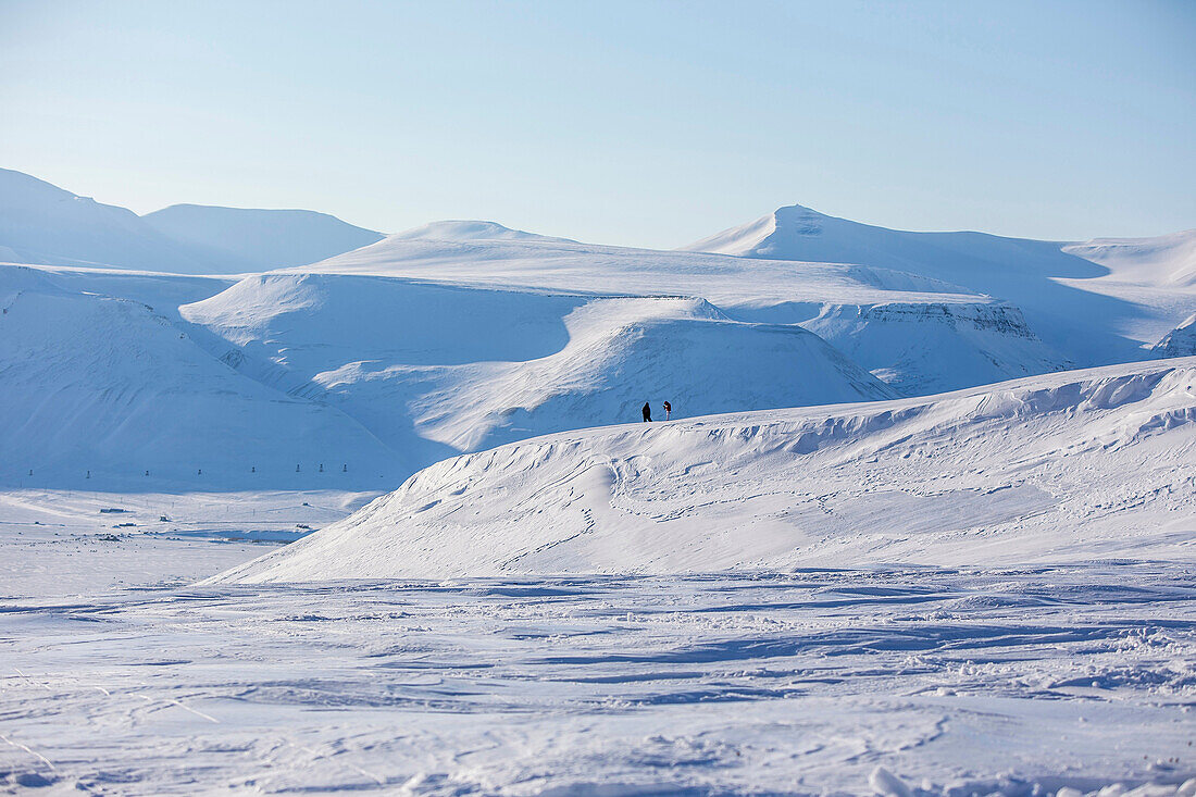 People in the snowy landscape of Spitzbergen, Svalbard, Norway
