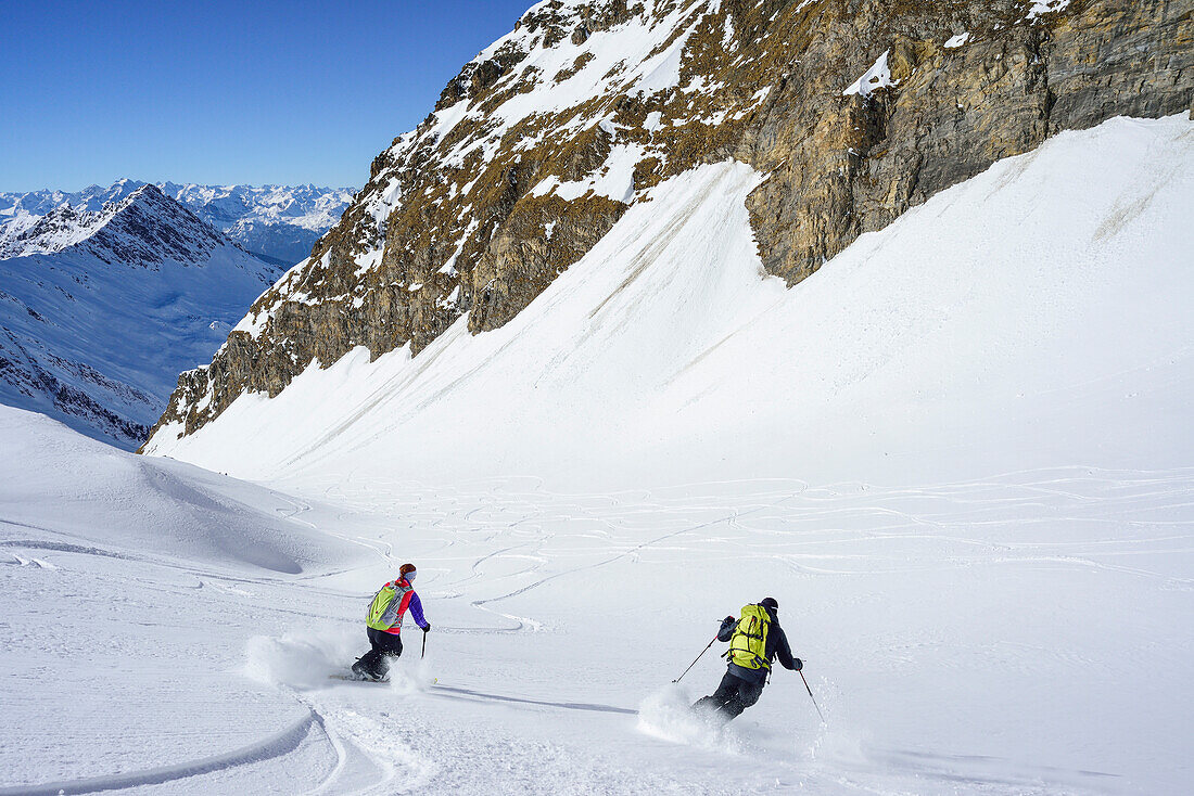 Two persons back-country skiing downhill from Kleiner Kaserer, Kleiner Kaserer, valley of Schmirn, Zillertal Alps, Tyrol, Austria