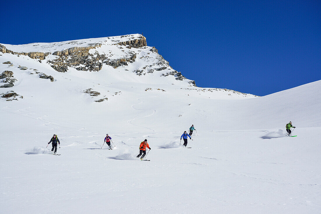 Several persons back-country skiing downhill from Kleiner Kaserer, Kleiner Kaserer, valley of Schmirn, Zillertal Alps, Tyrol, Austria